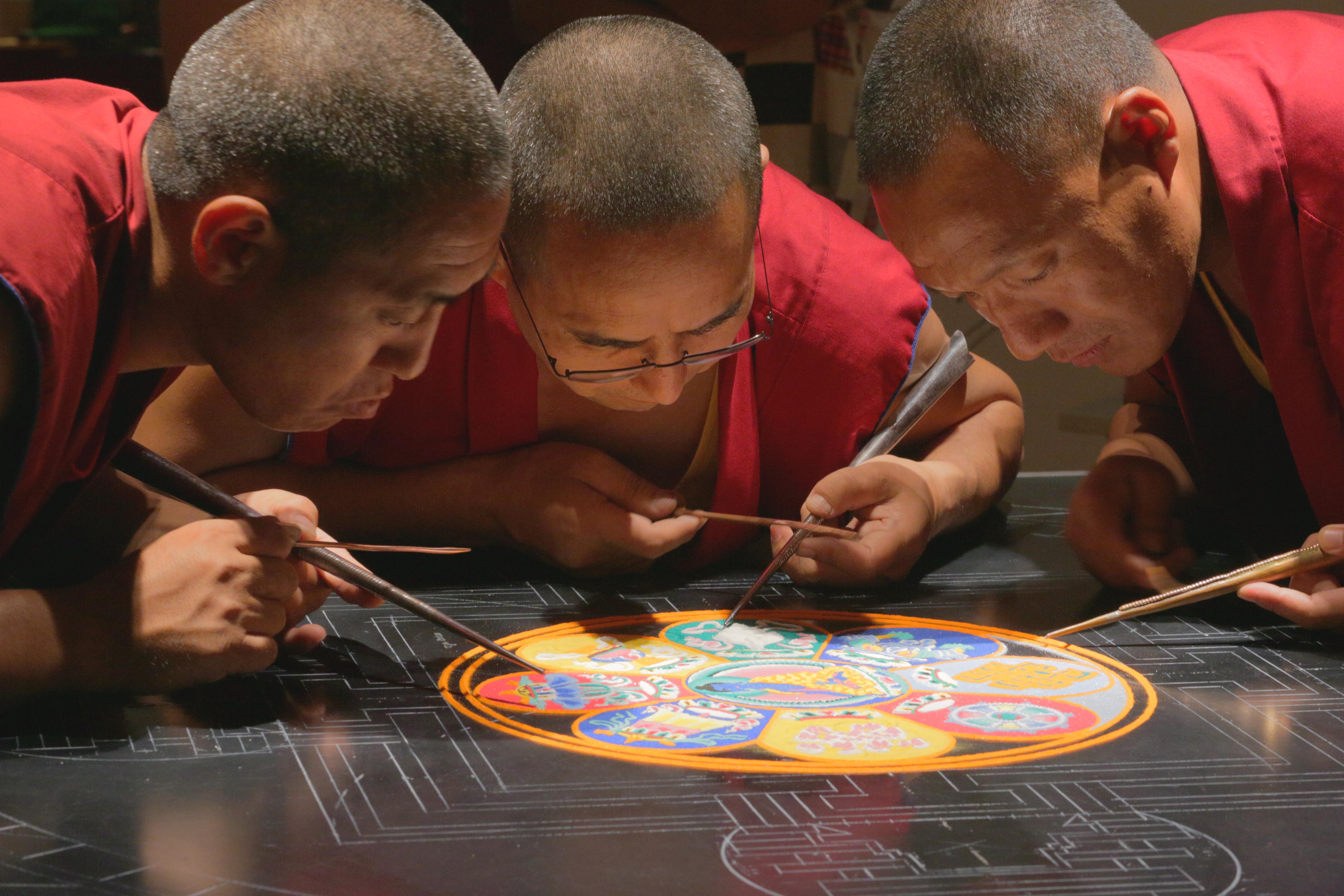 Monks creating sand mandala